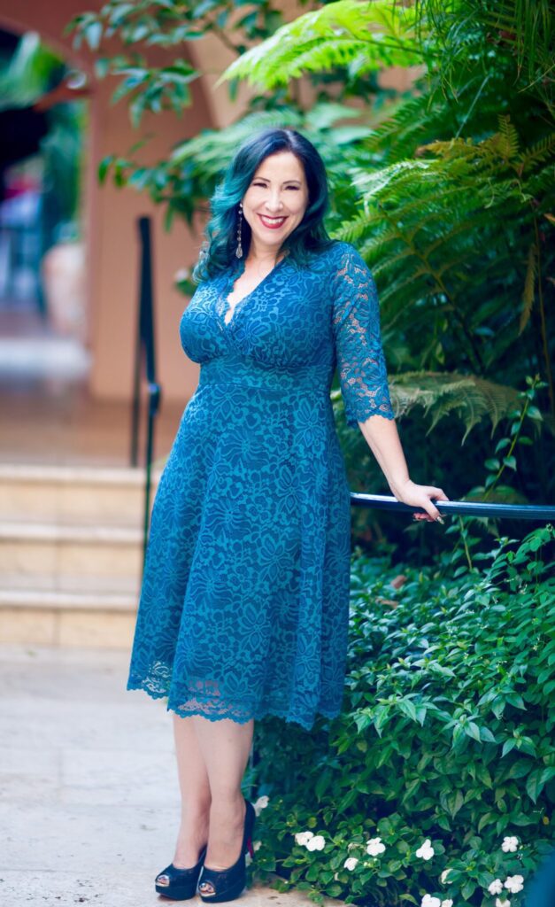 Woman in the perfect plus size special occasion dress from Kiyonna. 